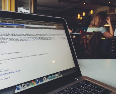 developer coding in cafe