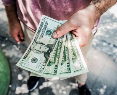 man holding dollars