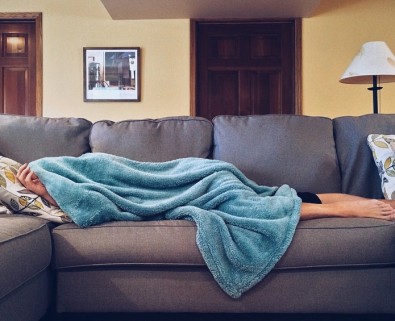 Woman sick on sofa