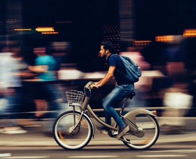 man on bike in city